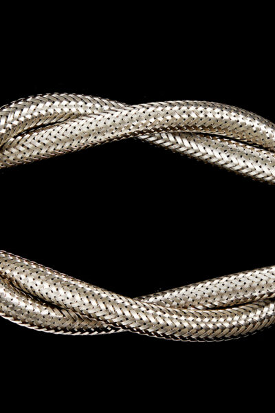 A metal hose pipe isolated on a black background