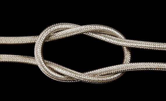 A metal hose pipe isolated on a black background