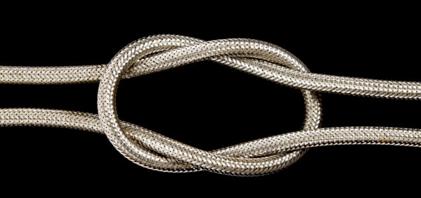 A metal hose pipe isolated on a black background