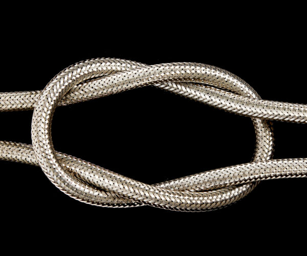 A metal hose pipe isolated on a black background