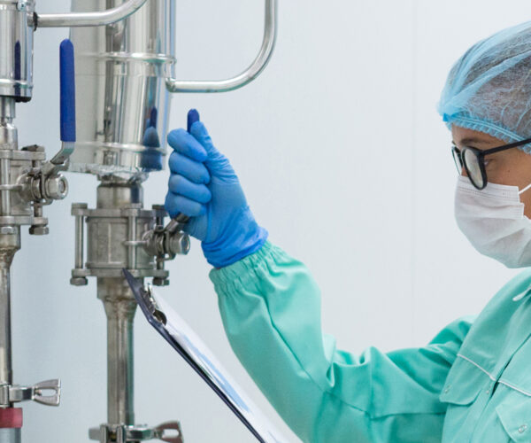 scientist in blue suit checking pressure